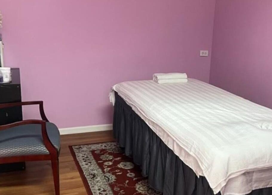 Relaxation room at Rainbow Spa, Schaumburg, Illinois, US with a massage table and soft lighting.
