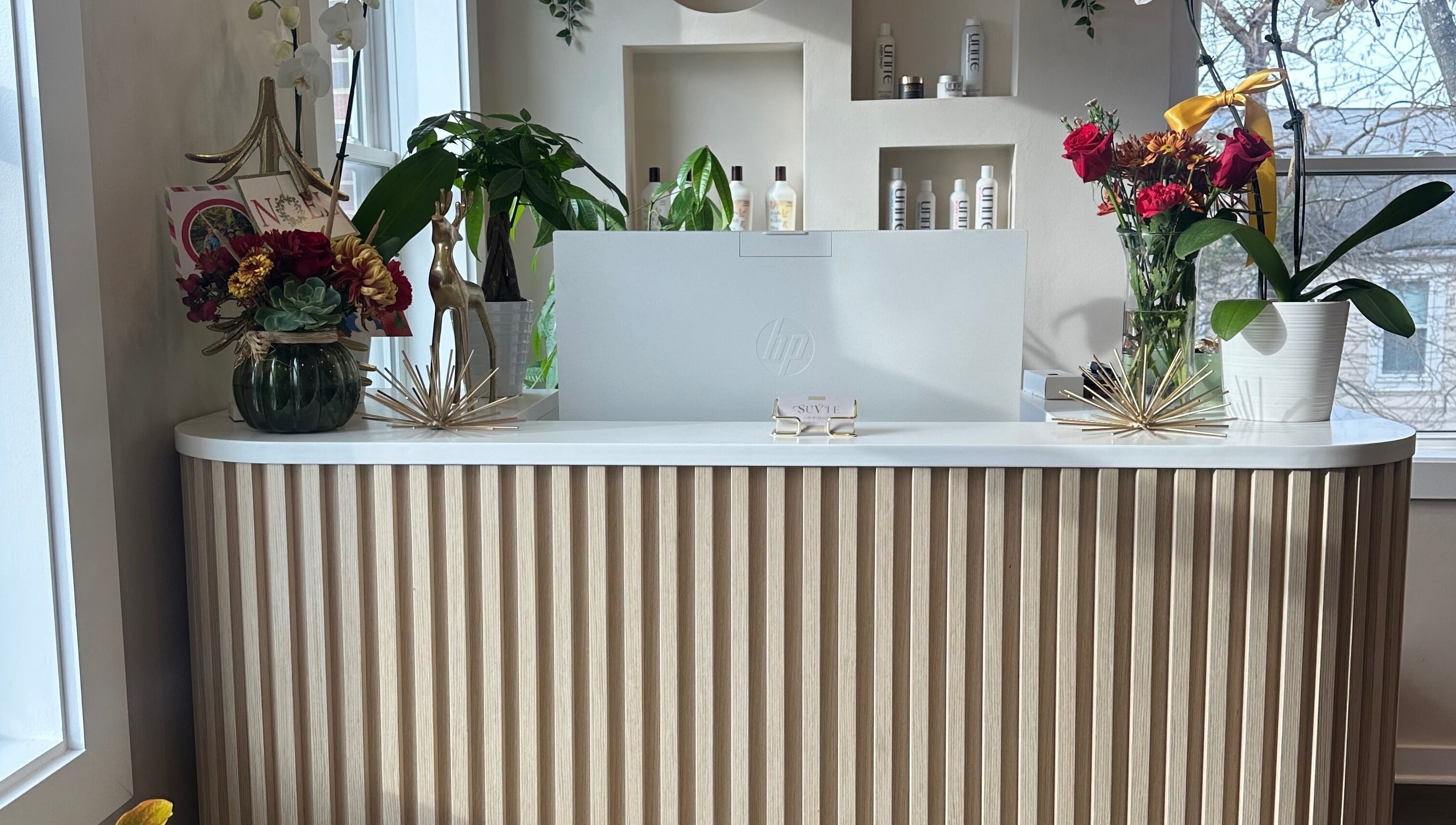 Reception at SuVie Salon and Suites in Alexandria, Virginia, US, featuring elegant decor and floral arrangements.