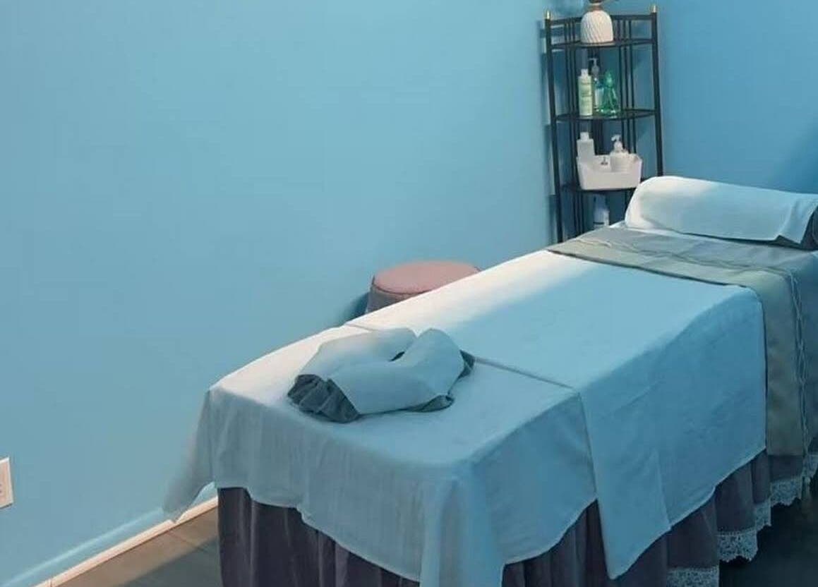 Relaxing massage room at XINGXING MASSAGE in Pomona, California, US, featuring a prepared massage table.