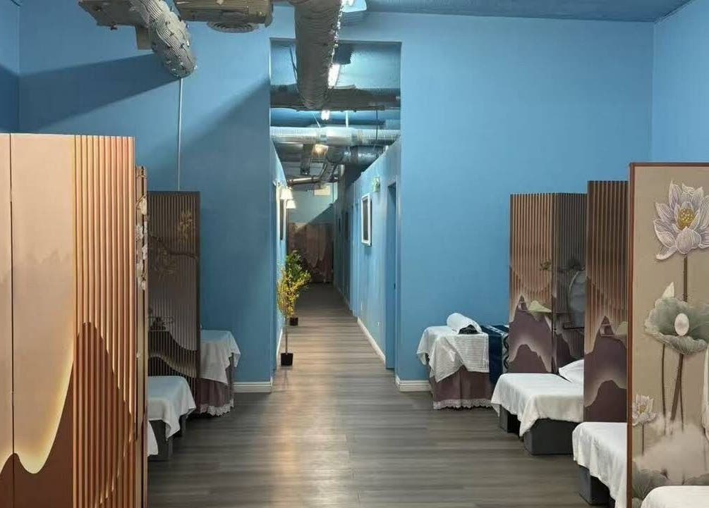 Relaxing spa room at XINGXING MASSAGE, Pomona, California, US, featuring serene decor and massage beds.