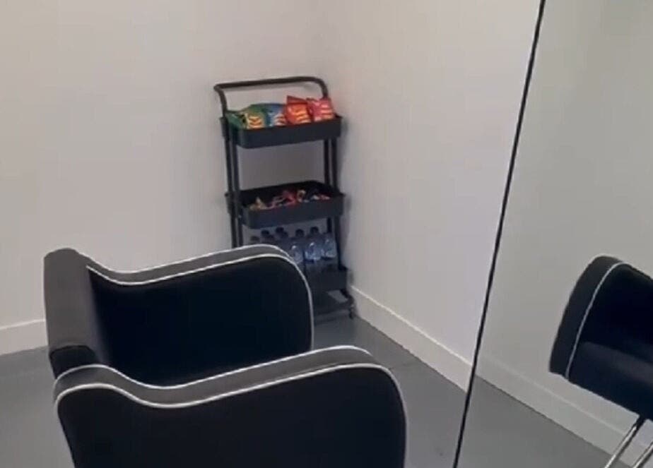 Chic salon corner at DreadsbyDy, London, England, GB, featuring a stylish chair and snack cart.