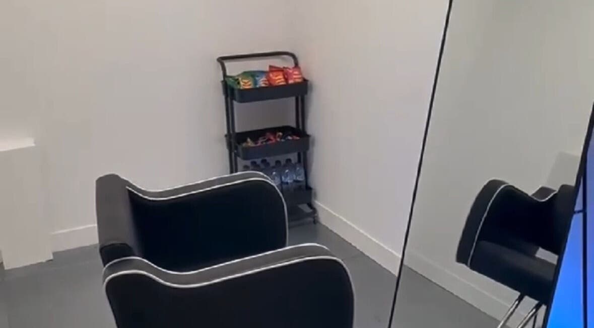 Chic salon corner at DreadsbyDy, London, England, GB, featuring a stylish chair and snack cart.