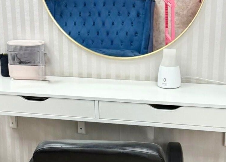 Elegant salon vanity at Dreads by Dy, London, England, GB, featuring a sleek mirror and stylish decor.