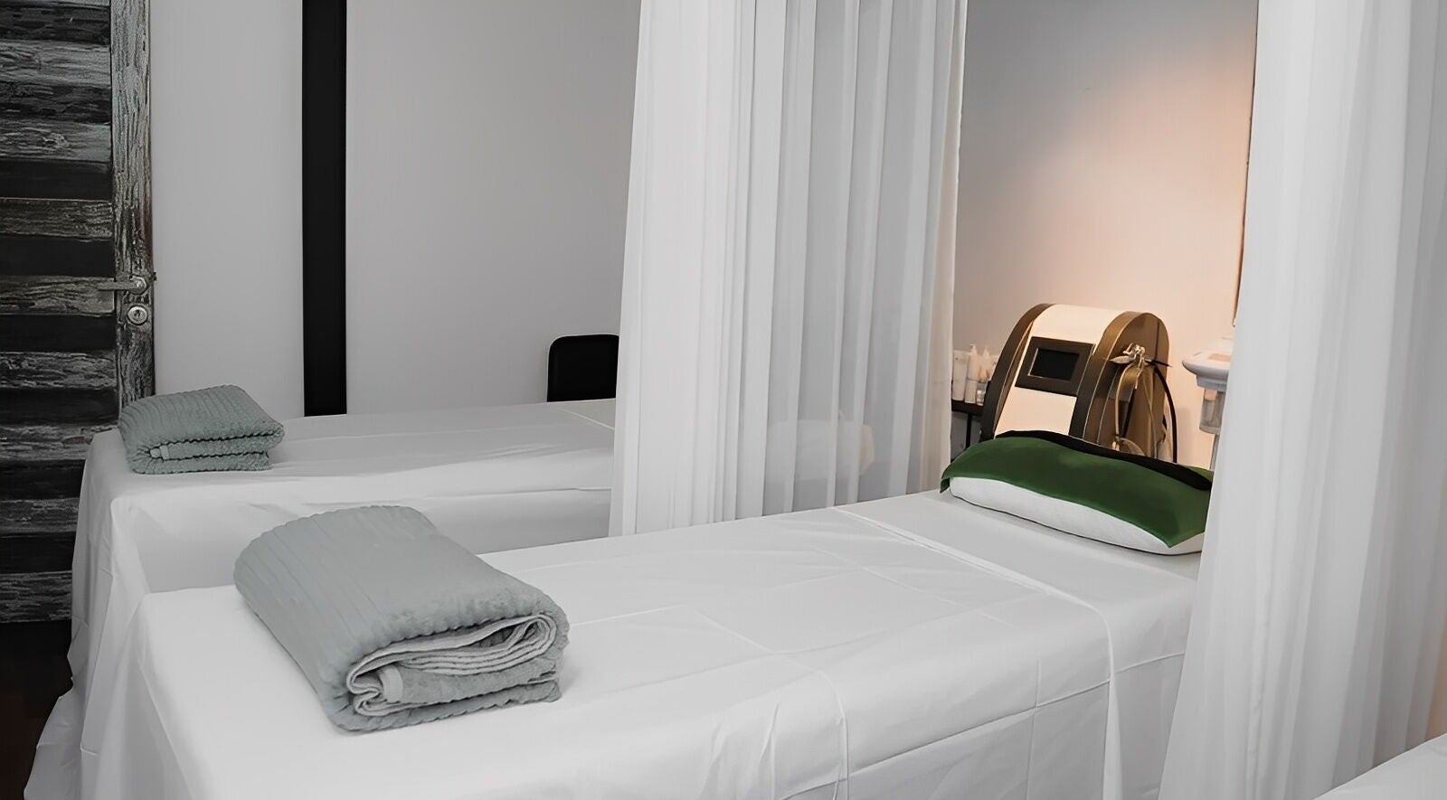 Relaxing treatment room at Amo Spa, Bali, Bali, ID with spa beds and ambient lighting.