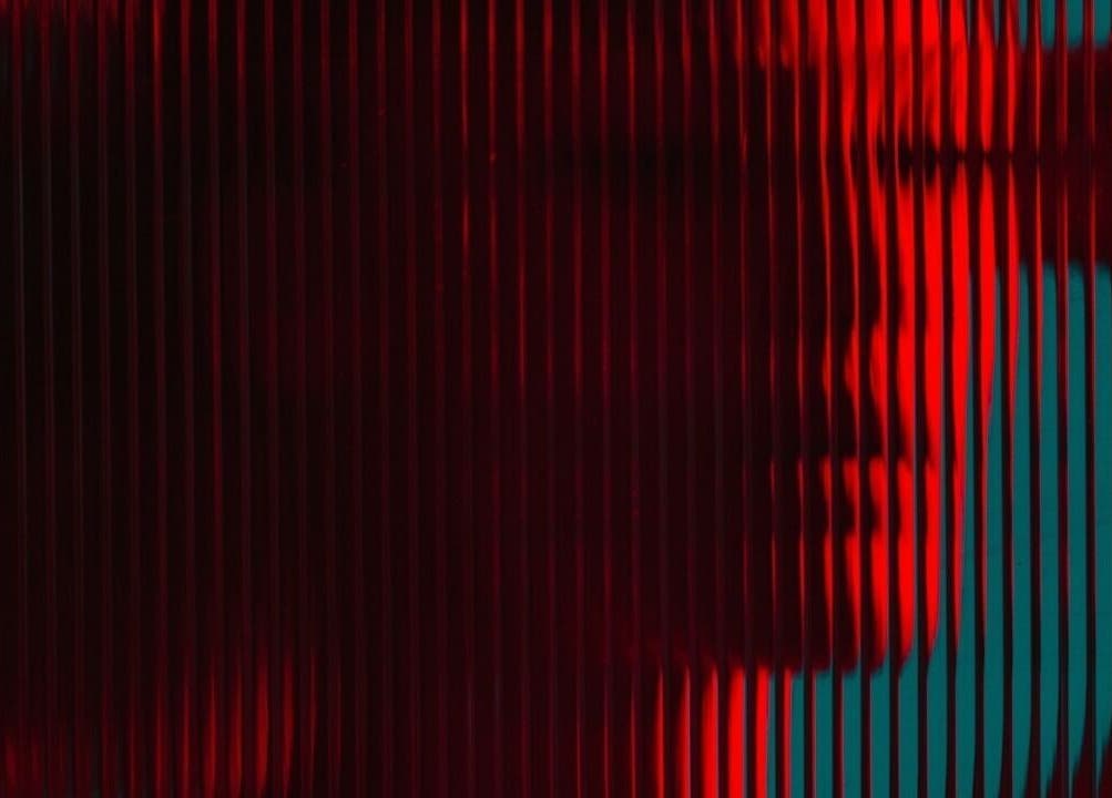 Abstract red and teal light patterns at CRYBABY HAIRCLUB, Glasgow, Scotland, GB, showcasing creative design.