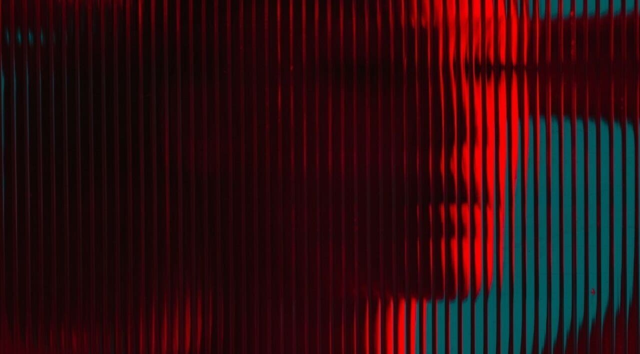 Abstract red and teal light patterns at CRYBABY HAIRCLUB, Glasgow, Scotland, GB, showcasing creative design.