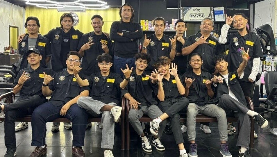 Team at MCo Barbershop Hq in Shah Alam, Selangor, MY, showcasing unity and style.