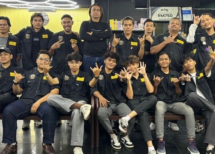 Team at MCo Barbershop Hq in Shah Alam, Selangor, MY, showcasing unity and style.