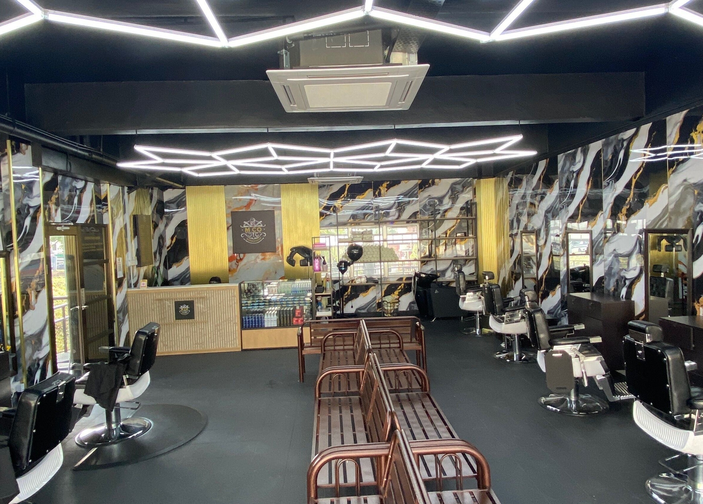 Chic interior of MCo Barbershop Hq in Shah Alam, Selangor, MY showcasing modern design and comfortable seating.