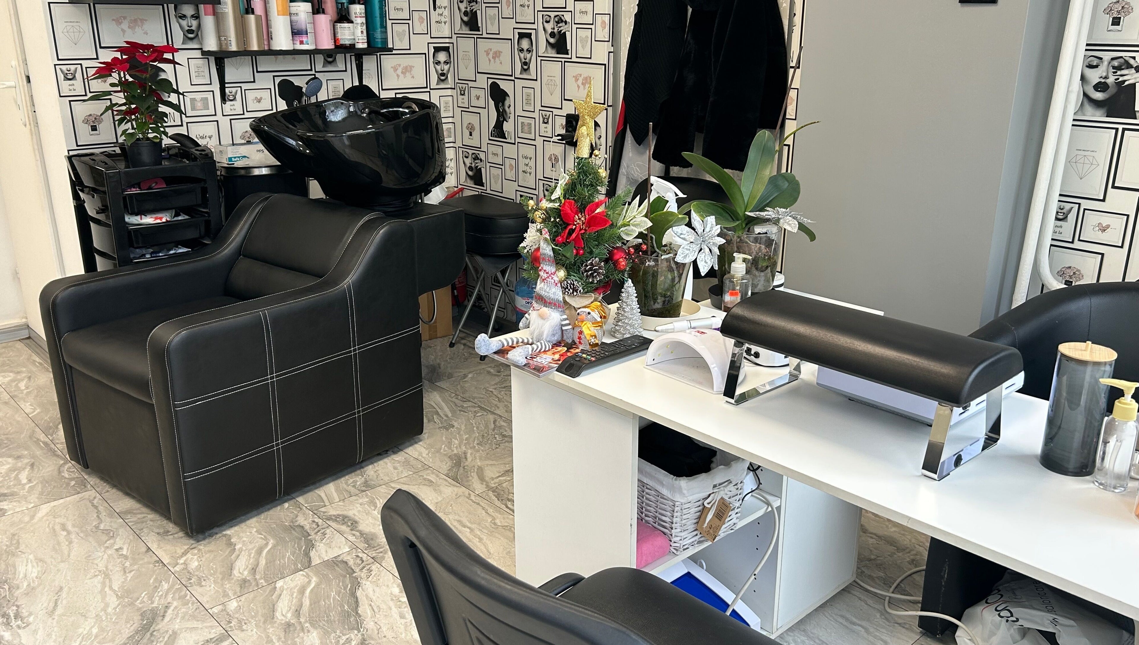 Elegant salon interior at Moni Style in Sofia, Sofia City Province, BG with black chairs and stylish decor.