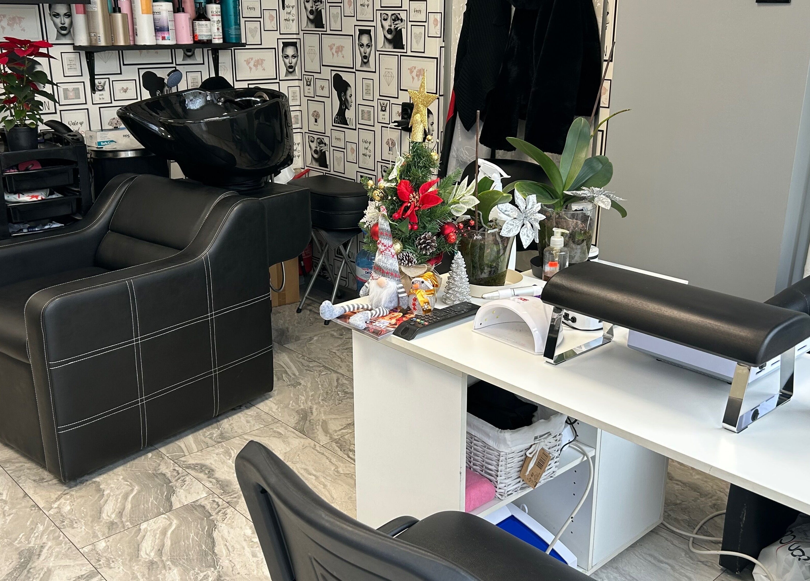 Elegant salon interior at Moni Style in Sofia, Sofia City Province, BG with black chairs and stylish decor.