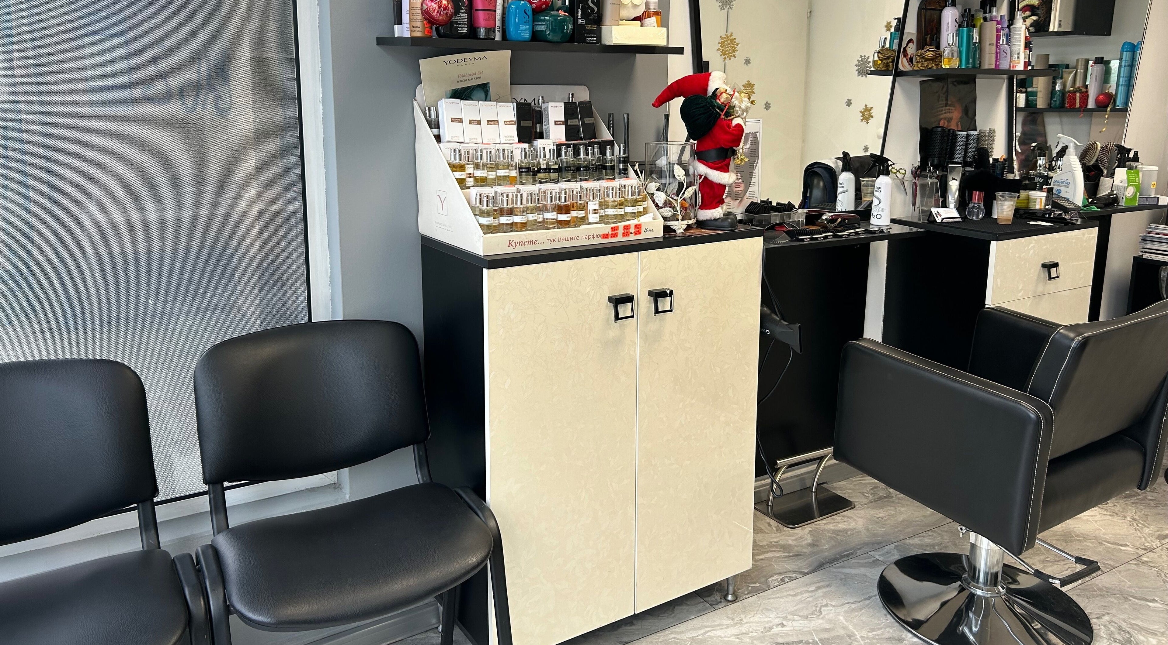Moni Style salon in Sofia, Sofia City Province, BG with sleek chairs and stylish product display.
