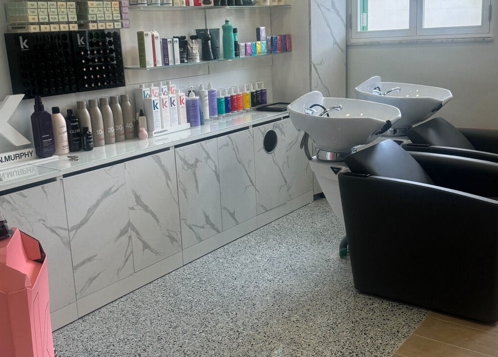 Luxi Hairdressing shampoo station with sleek chairs and products in Tas-sliema, MT.
