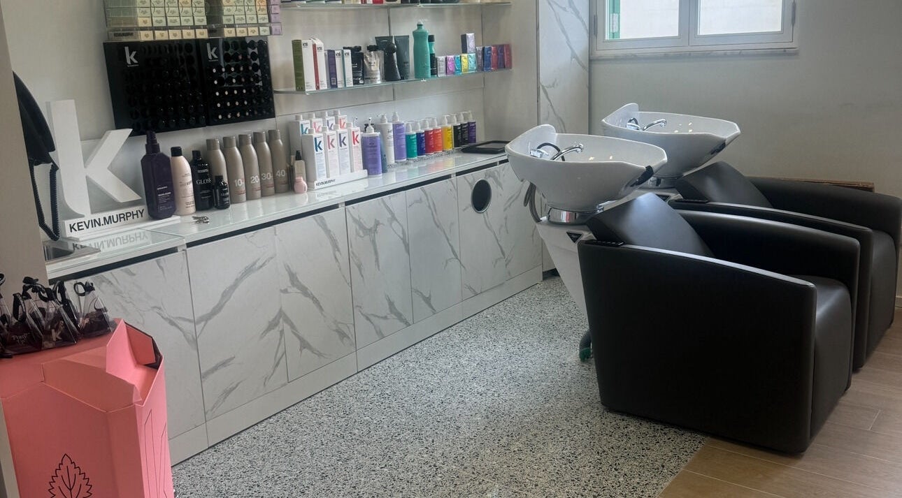 Luxi Hairdressing shampoo station with sleek chairs and products in Tas-sliema, MT.