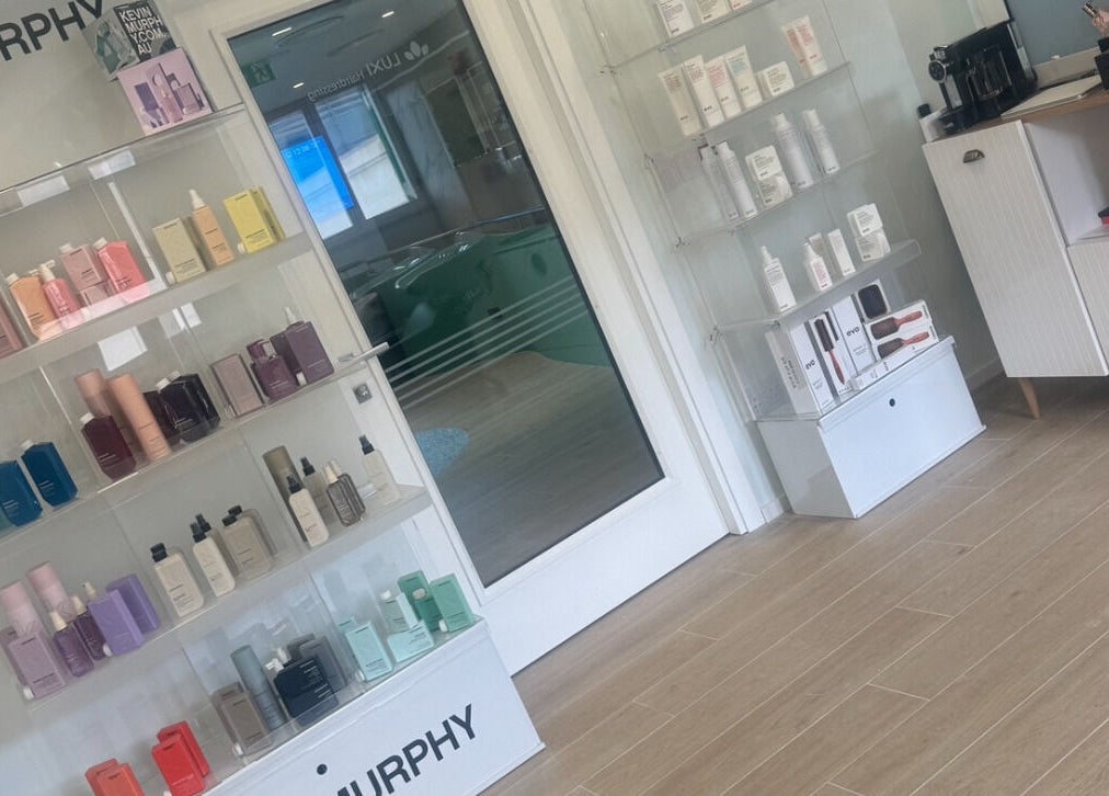 Luxi Hairdressing product shelves in Tas-sliema, MT featuring hair care essentials.
