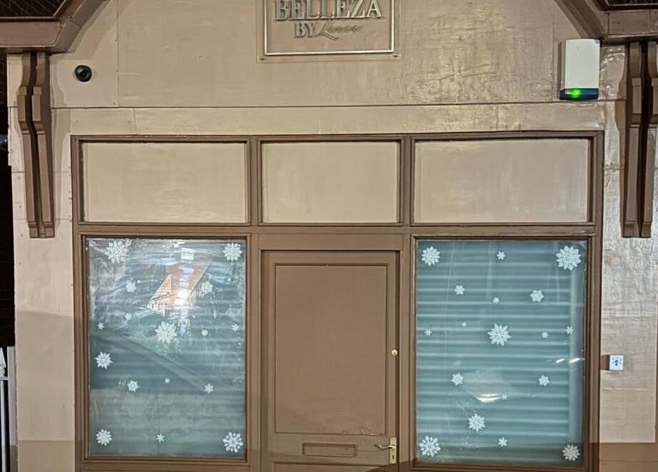 Front view of Megnificent.Nailsss in Gateshead, England, GB with festive window decor.