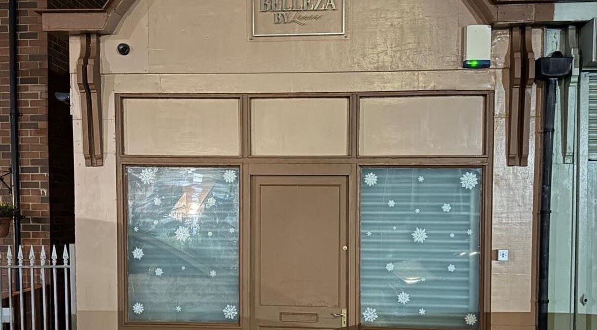 Front view of Megnificent.Nailsss in Gateshead, England, GB with festive window decor.