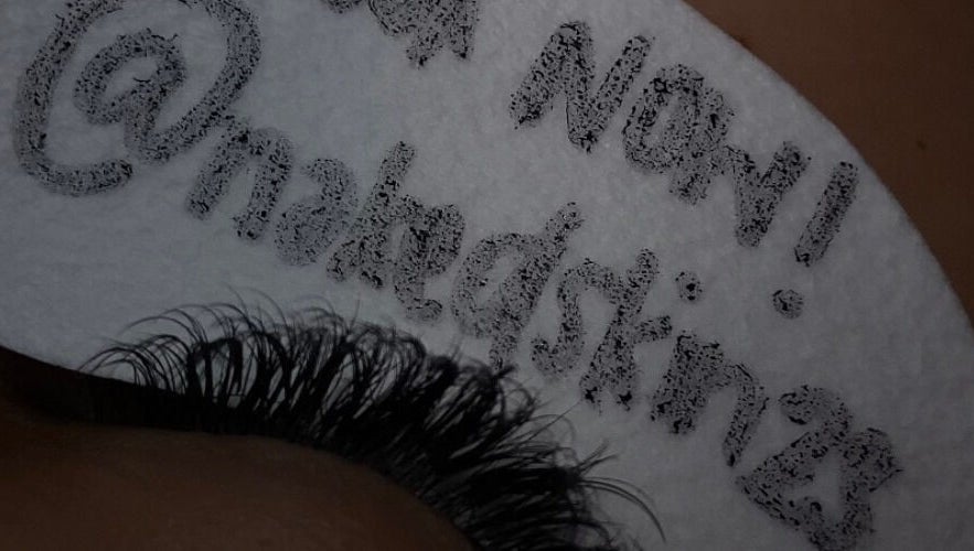 NĀSKIN promotes lash extensions in Cape Town, Western Cape, ZA with unique branding in this detailed close-up.