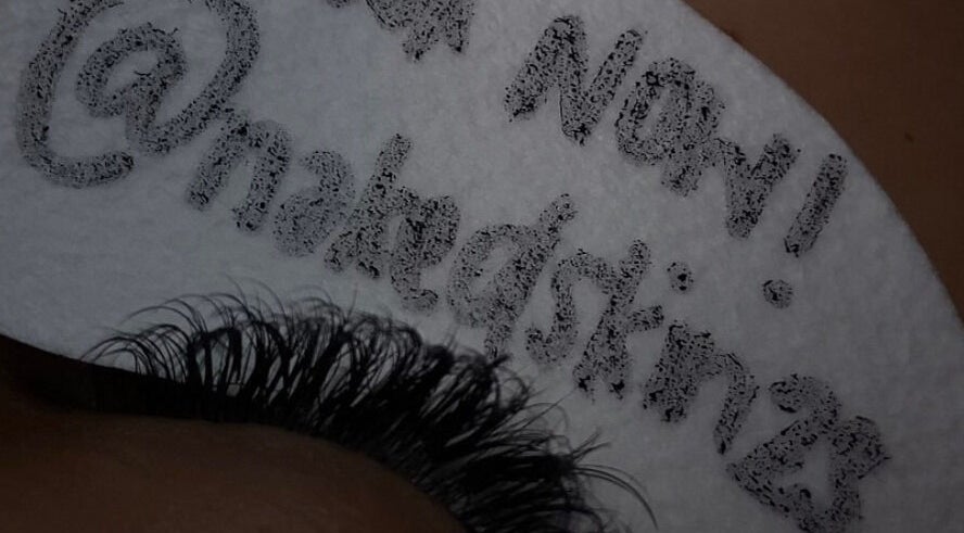NĀSKIN promotes lash extensions in Cape Town, Western Cape, ZA with unique branding in this detailed close-up.