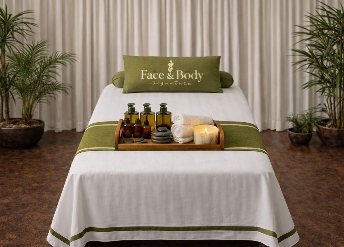 Relaxing spa setup at Face & Body Signature - Home Service, Dubai, Dubai, AE, with oils and candles.