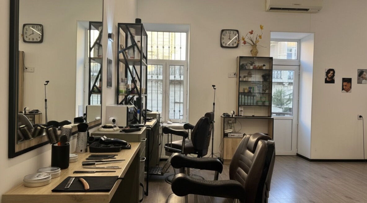 Interior view of Barbershop by Z, Bakı, AZ. Features salon chairs, mirrors, and grooming tools in a well-lit space.