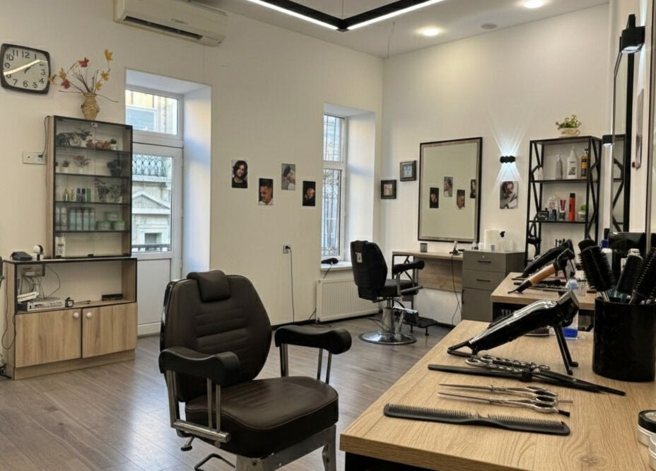 Modern interior of Barbershop by Z, Bakı, AZ with styling stations and tools.