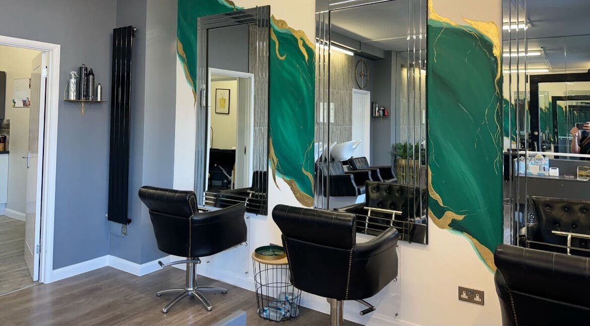 Stylish salon chairs and mirror at Makeupbyparislauren, Bristol, England, GB showcase elegance.