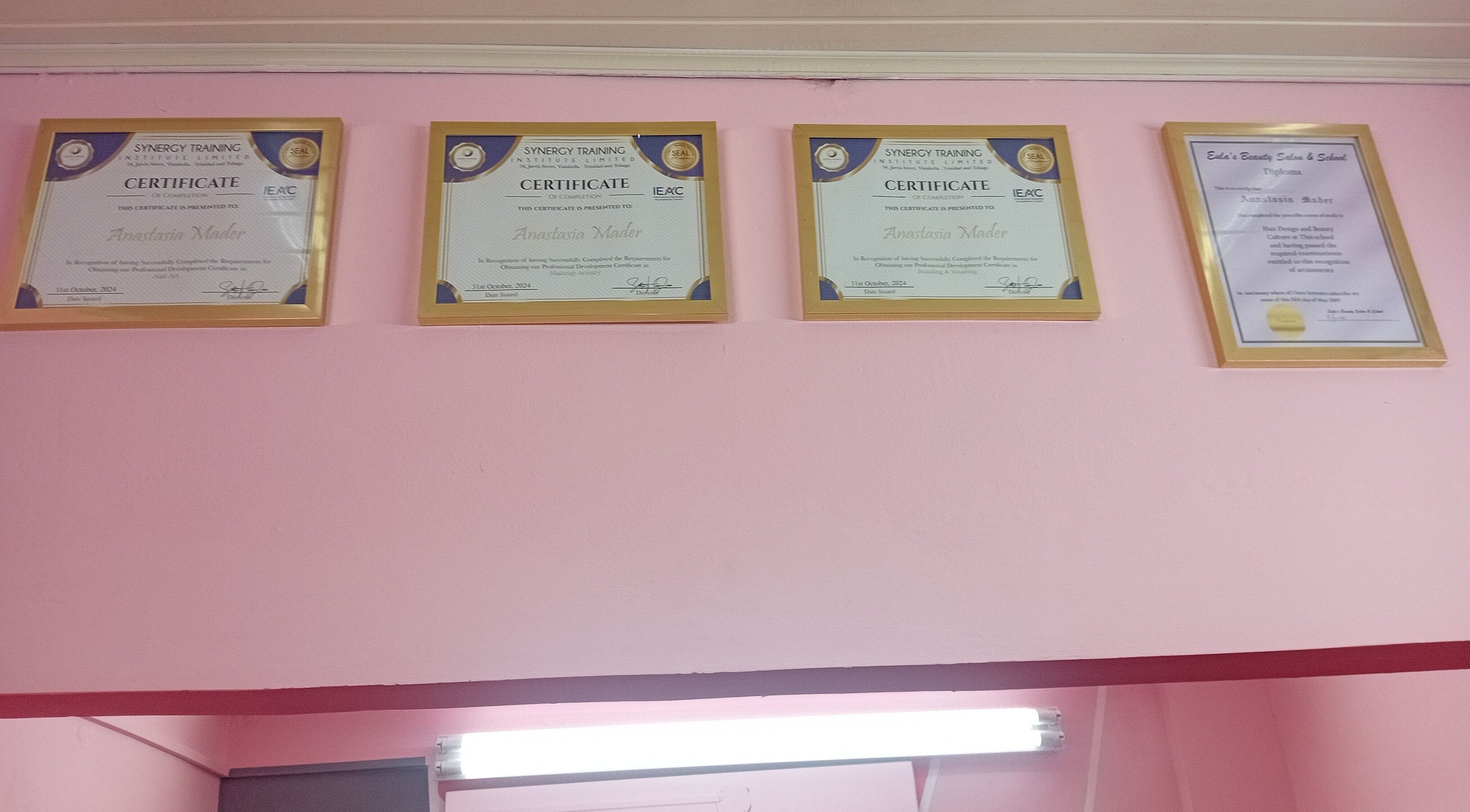 Certificates at Anastasia's Beauty Co™ in Esmeralda, Caroni, TT showcasing professional accolades.