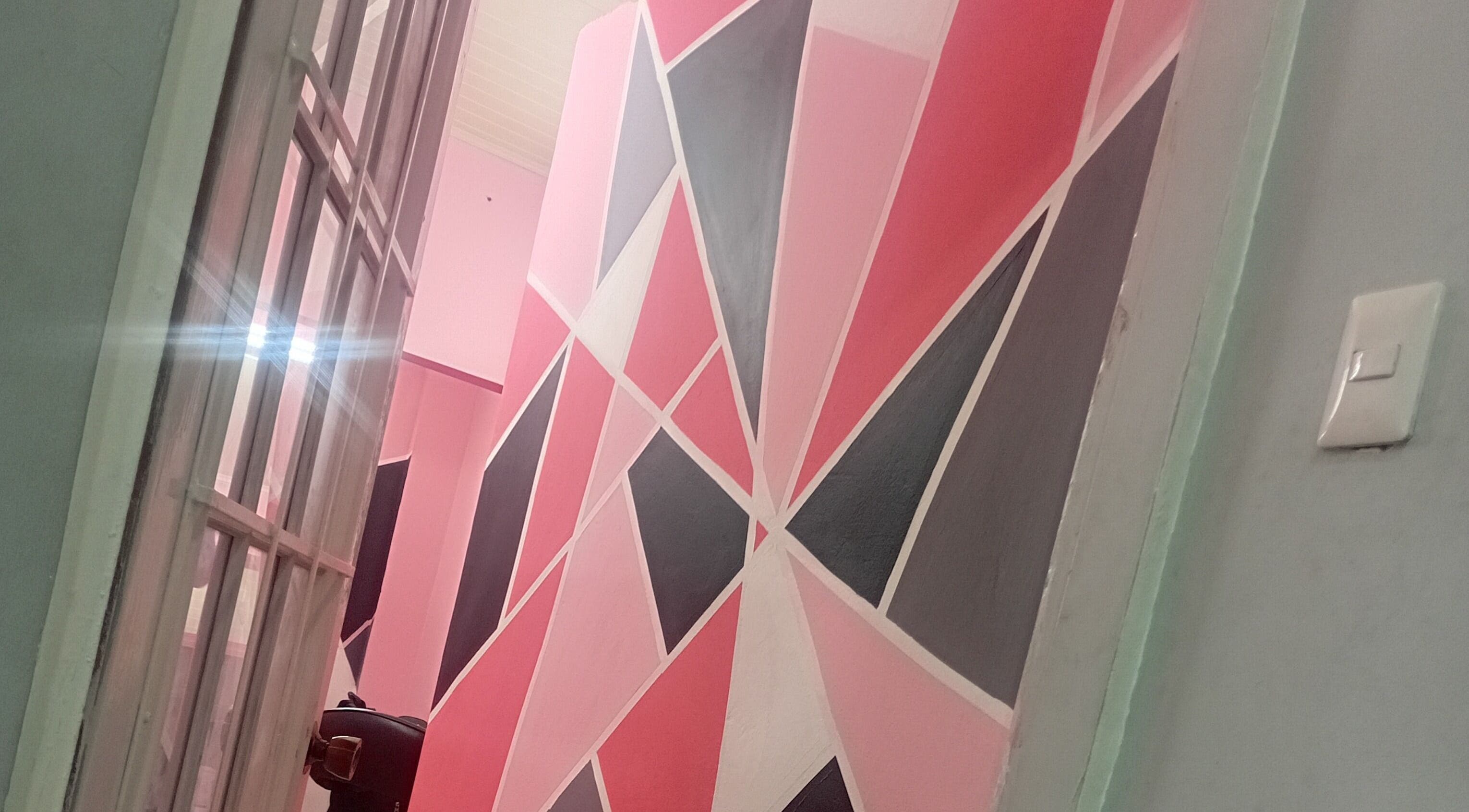 Vibrant geometric wall design at Anastasia's Beauty Co™, Esmeralda, Caroni, TT.