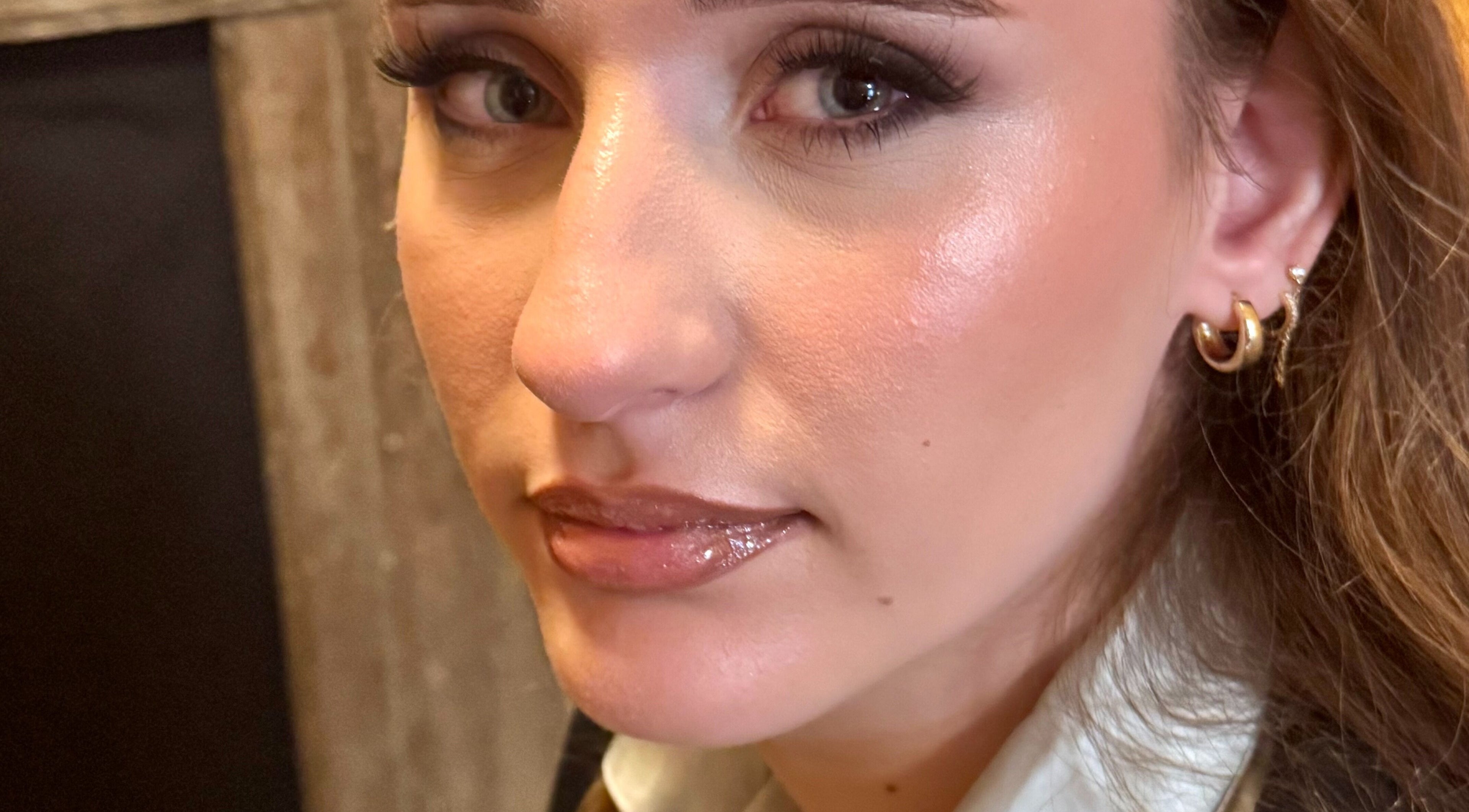 Close-up of a woman with glowing makeup at NXO Beauty Co., Houston, Texas, US.