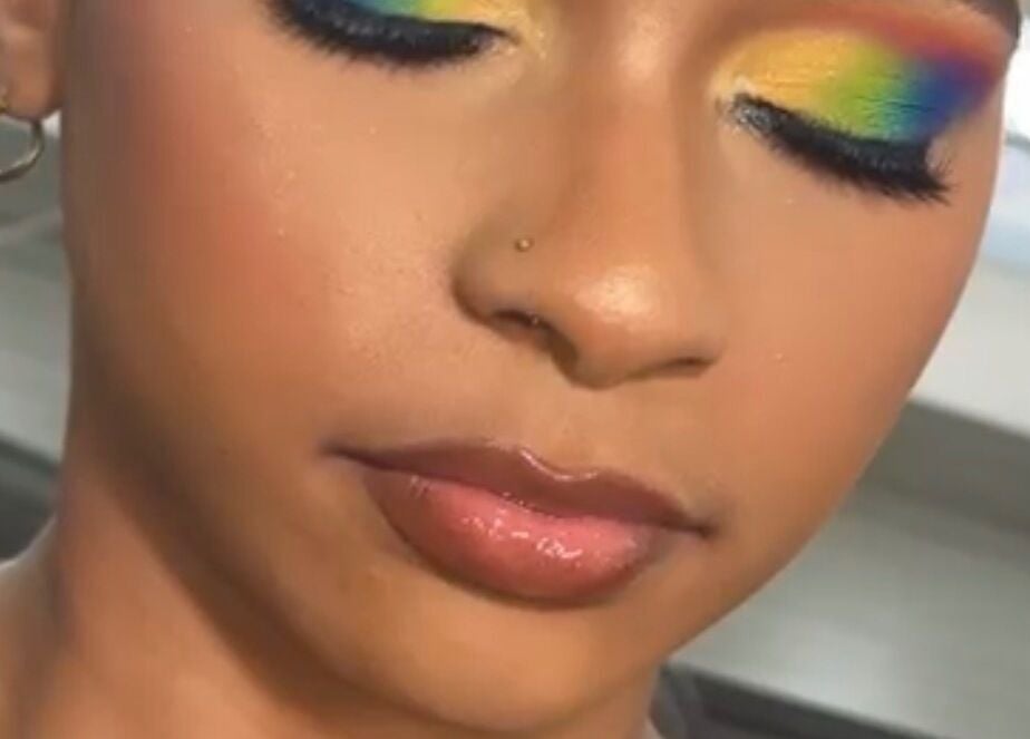 Bright rainbow eye makeup beautifully done at Beauty by Lys in TT.