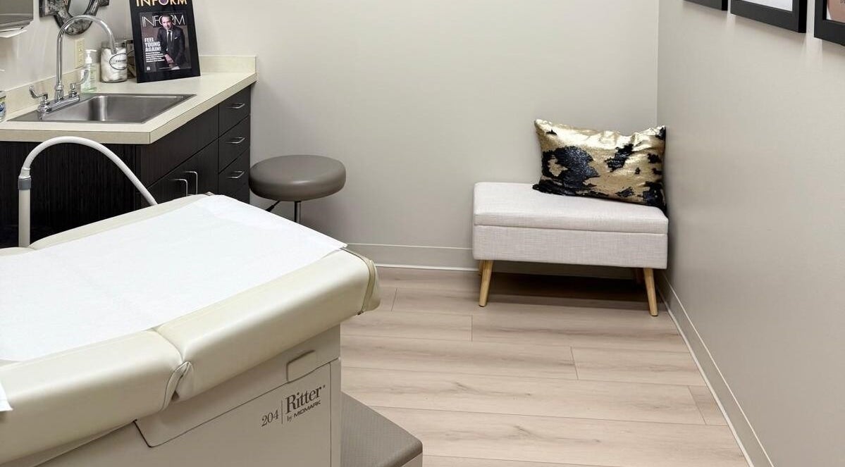 Cozy treatment room at Natural Hormone Replacement Center in Dallas, Texas, US with plush seating.