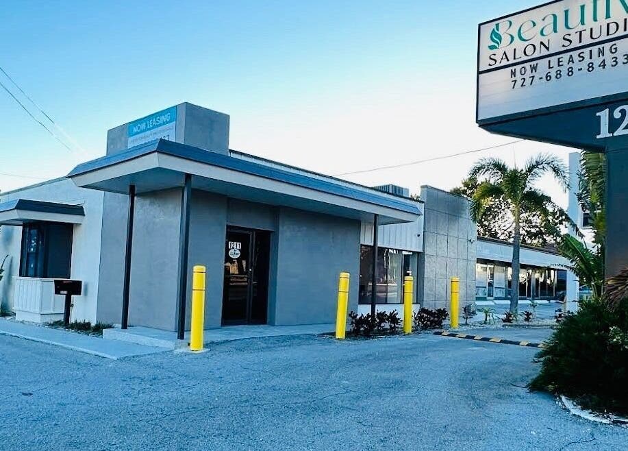 Exterior of Apapacho Studio in Clearwater, Florida, US, showcasing modern design with palm trees.