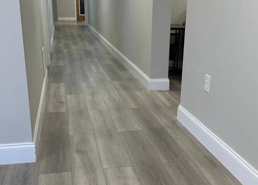 Modern hallway floor at Apapacho Studio, Clearwater, Florida, US with elegant wood design.