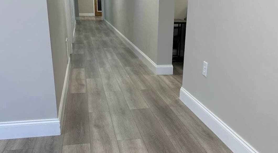 Modern hallway floor at Apapacho Studio, Clearwater, Florida, US with elegant wood design.