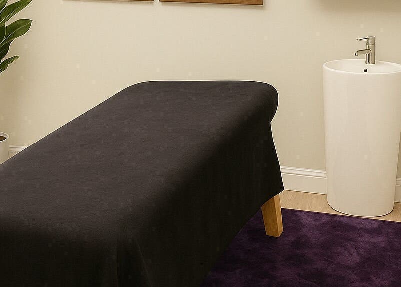Tranquil massage room at Apapacho Studio in Clearwater, Florida, US, featuring a massage table and serene decor.