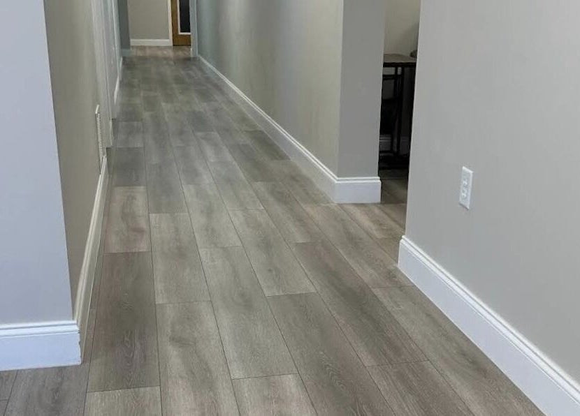 Sleek hallway at Apapacho Studio in Clearwater, Florida, US, featuring modern wood flooring and a serene ambiance.