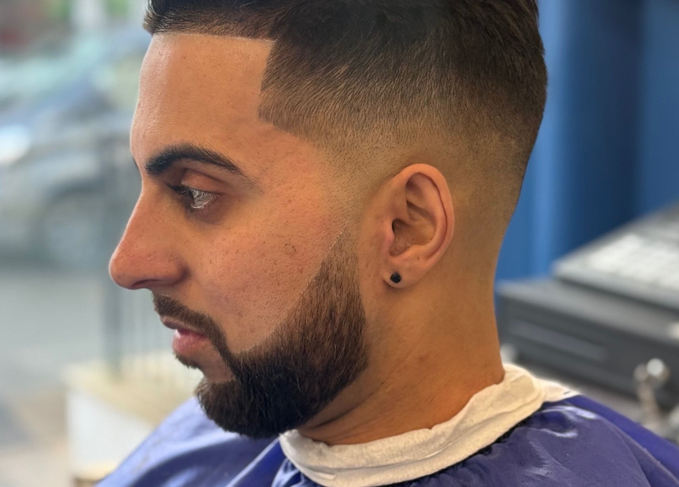 Close-up of a modern hairstyle at Marlos Barber High Wycombe, showcasing precise cutting in High Wycombe, England, GB.