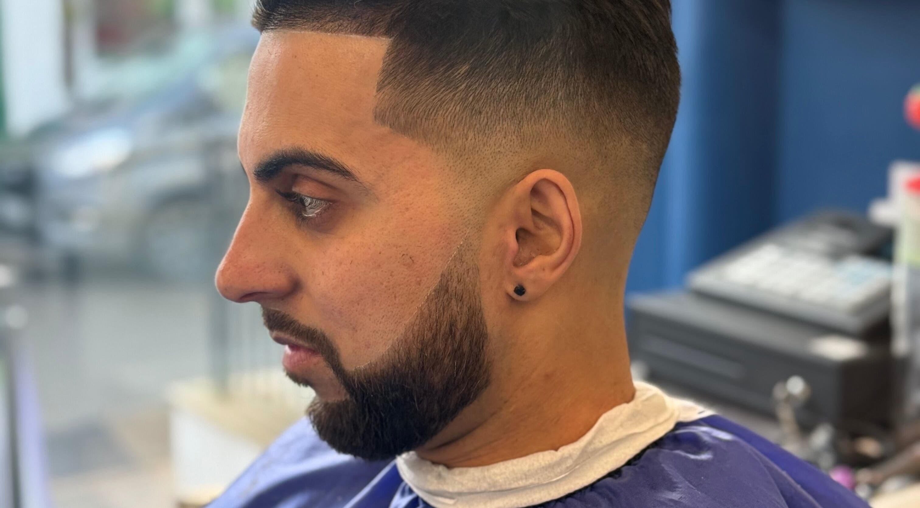 Close-up of a modern hairstyle at Marlos Barber High Wycombe, showcasing precise cutting in High Wycombe, England, GB.