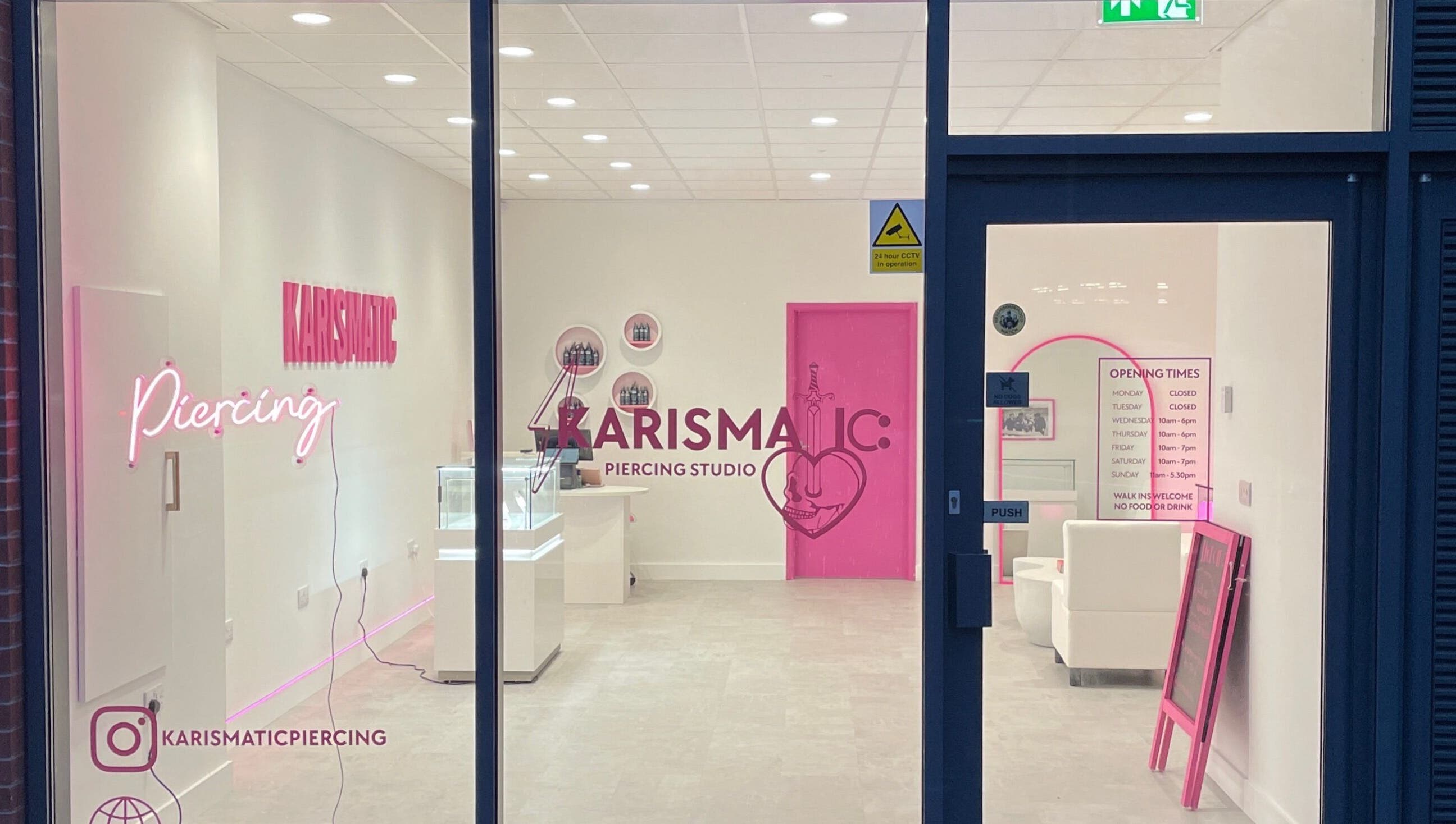 Karismatic Studio in Derby, England, GB viewed from outside, showcasing sleek interior and neon signage.