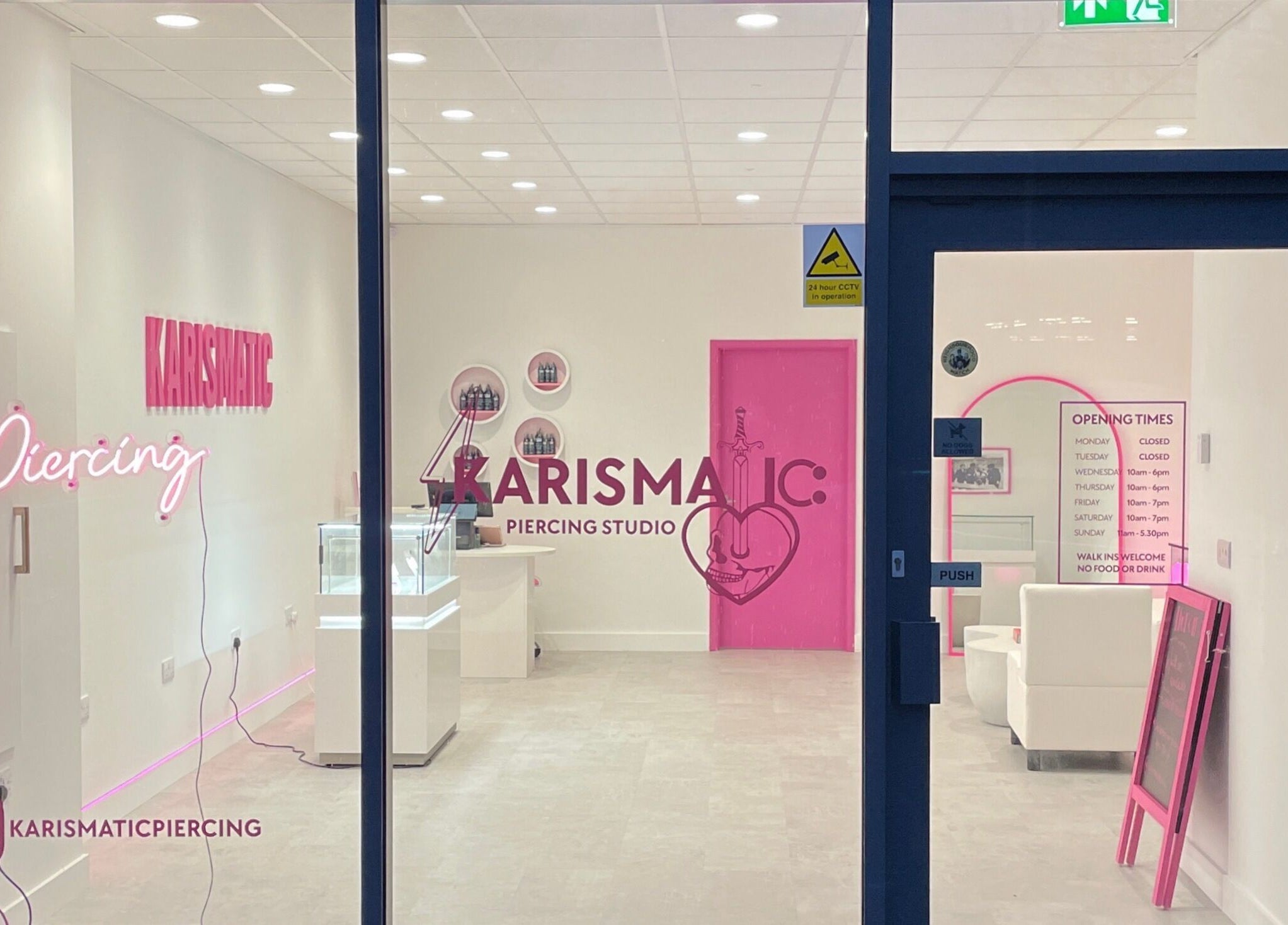 Karismatic Studio in Derby, England, GB viewed from outside, showcasing sleek interior and neon signage.