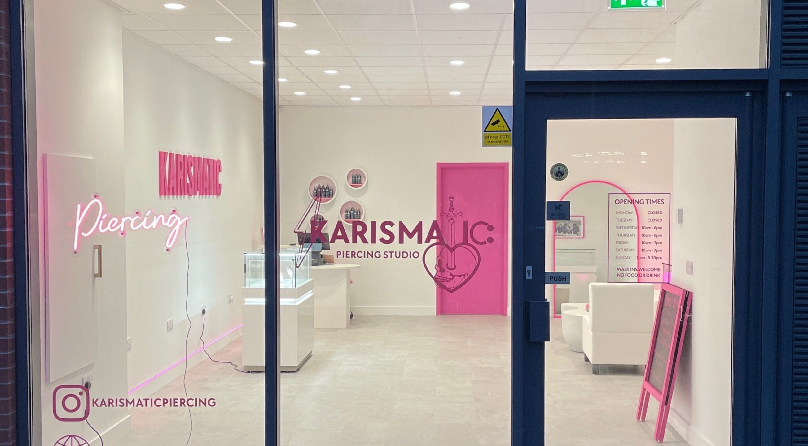 Karismatic Studio in Derby, England, GB viewed from outside, showcasing sleek interior and neon signage.