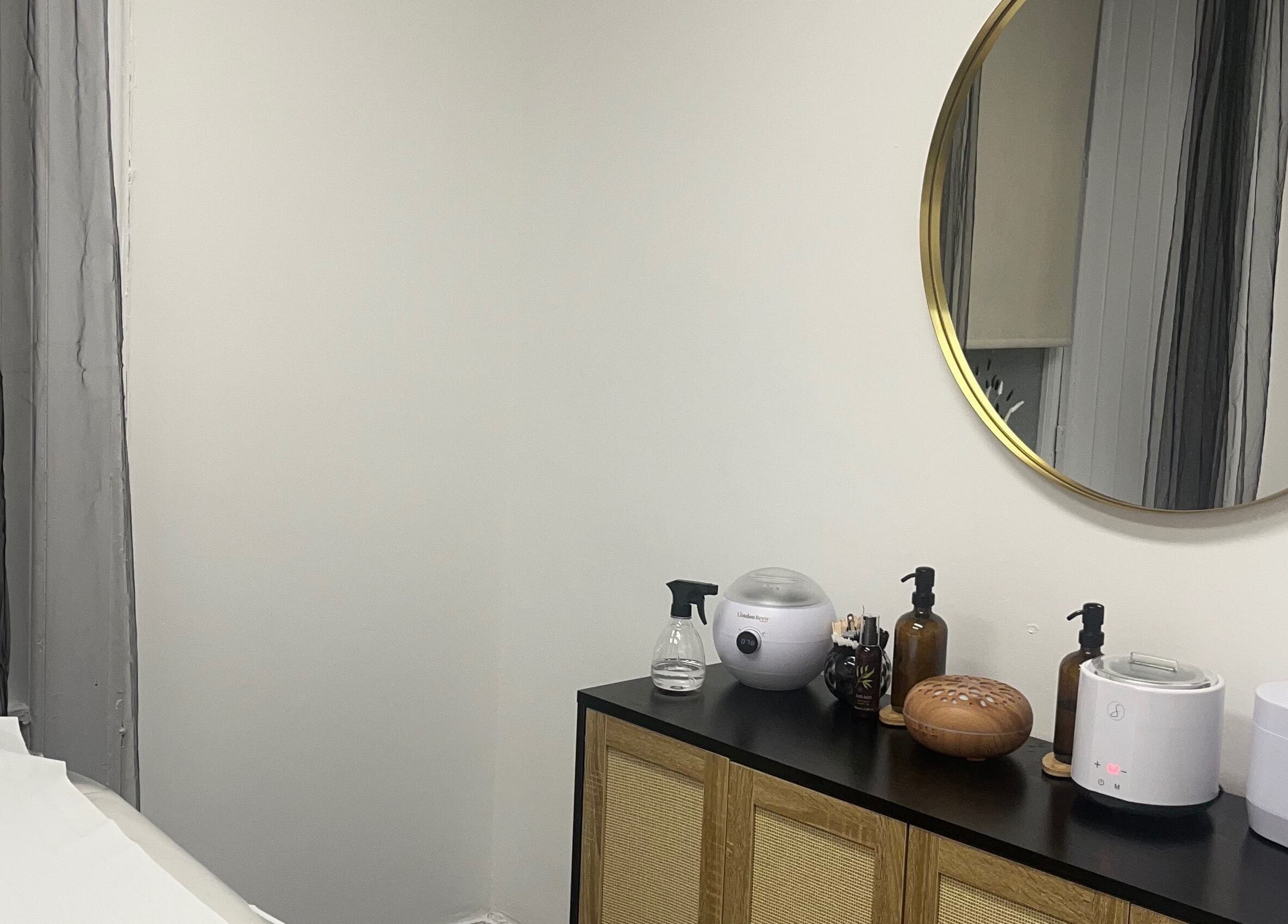 Stylish treatment room at Wylde Wax Studio in Glasgow, Scotland, GB, featuring elegant decor and spa tools.