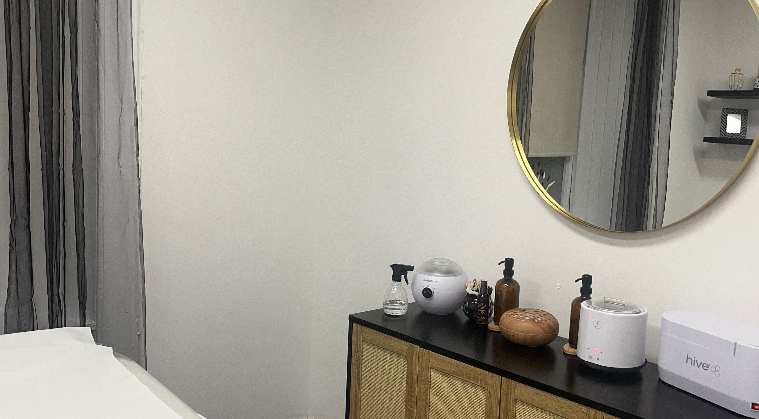 Stylish treatment room at Wylde Wax Studio in Glasgow, Scotland, GB, featuring elegant decor and spa tools.