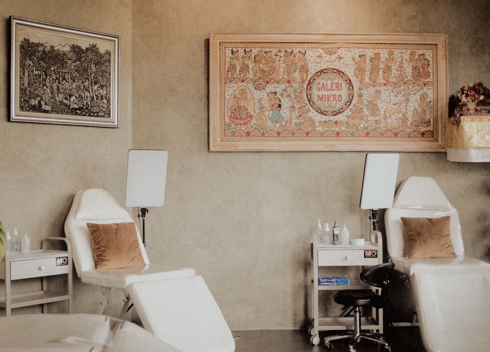 Cozy and stylish interior of Galerimikro Tattoo Studio in Bali, Bali, ID, with plush chairs and artistic decor.