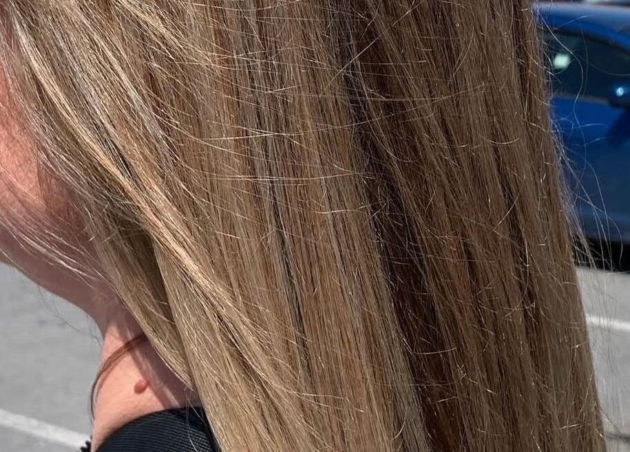 Close-up of sunlit blonde hair at Hair_By_Taej, Abbotsford, British Columbia, CA.