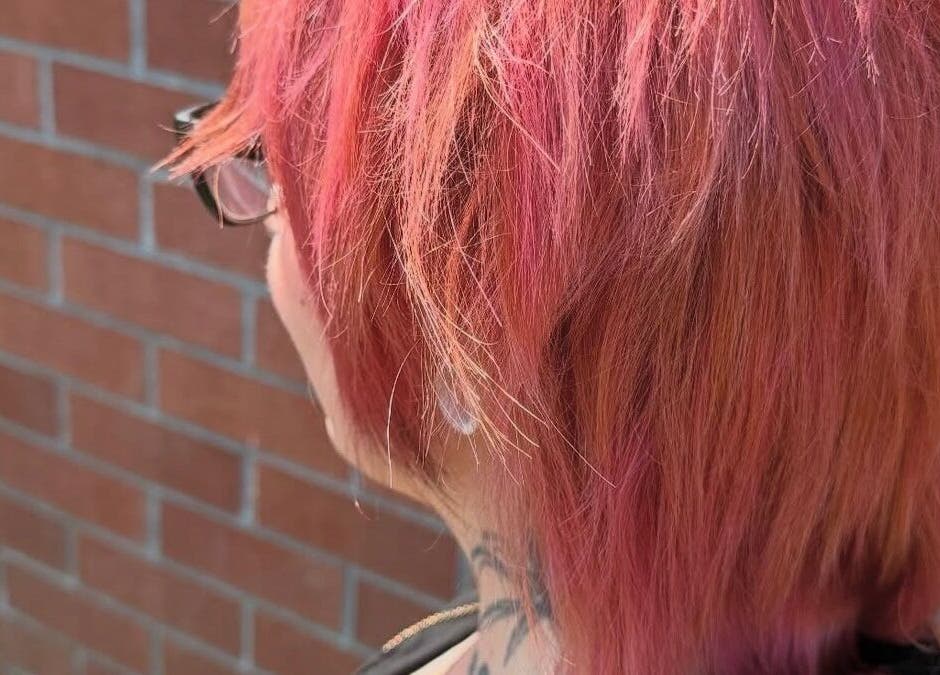 Vibrant pink and orange pixie cut at Hair_By_Taej in Abbotsford, British Columbia, CA.