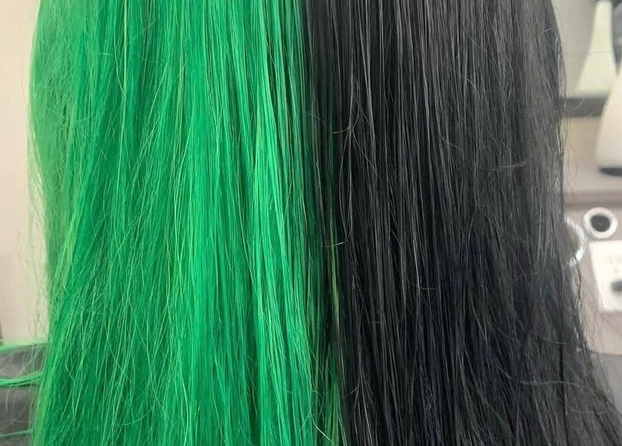 Striking half green, half black hairstyle at Hair_By_Taej, Abbotsford, British Columbia, CA.