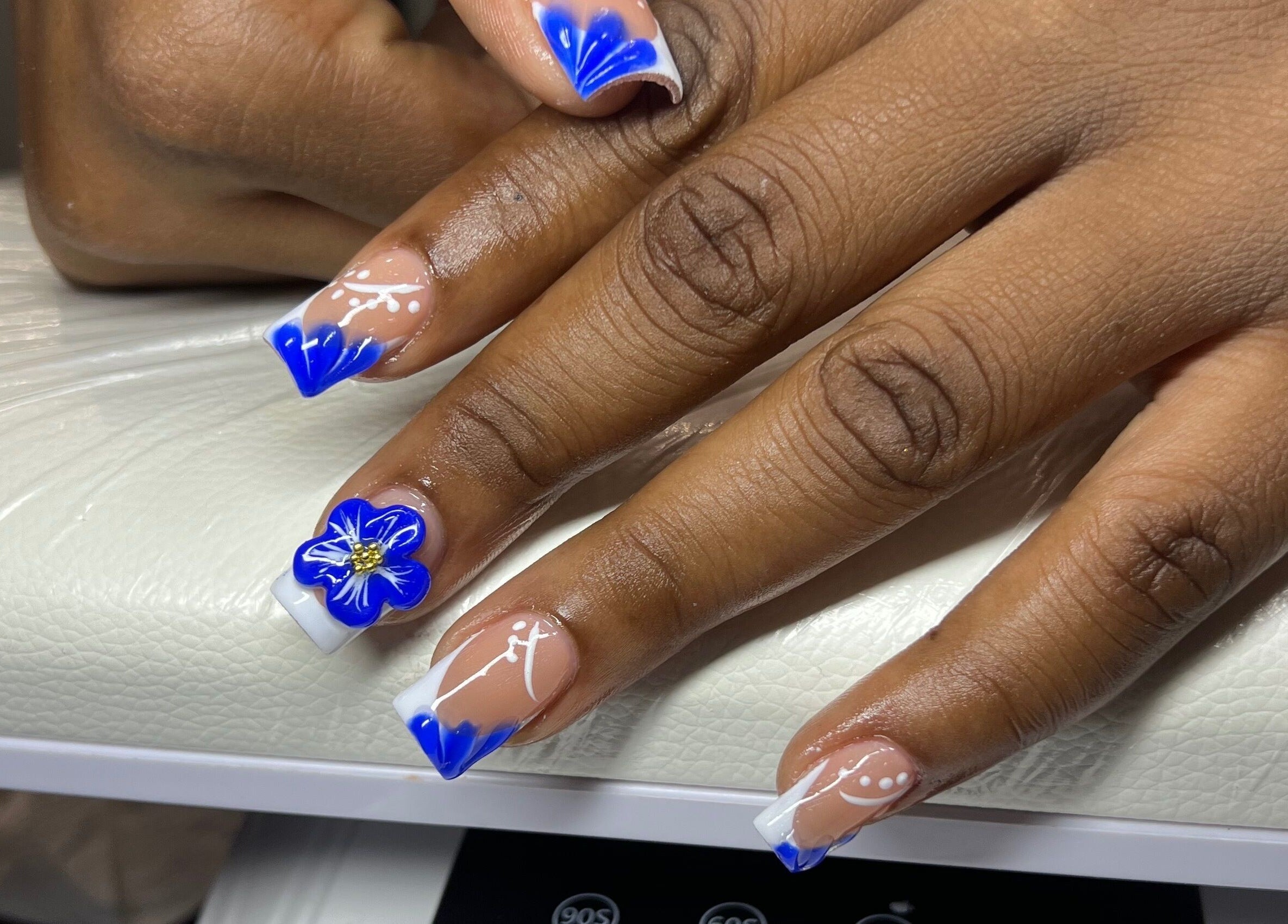 Elegant blue floral nail art at Luxe nails by Sher, Montego Bay, St. James Parish, JM.