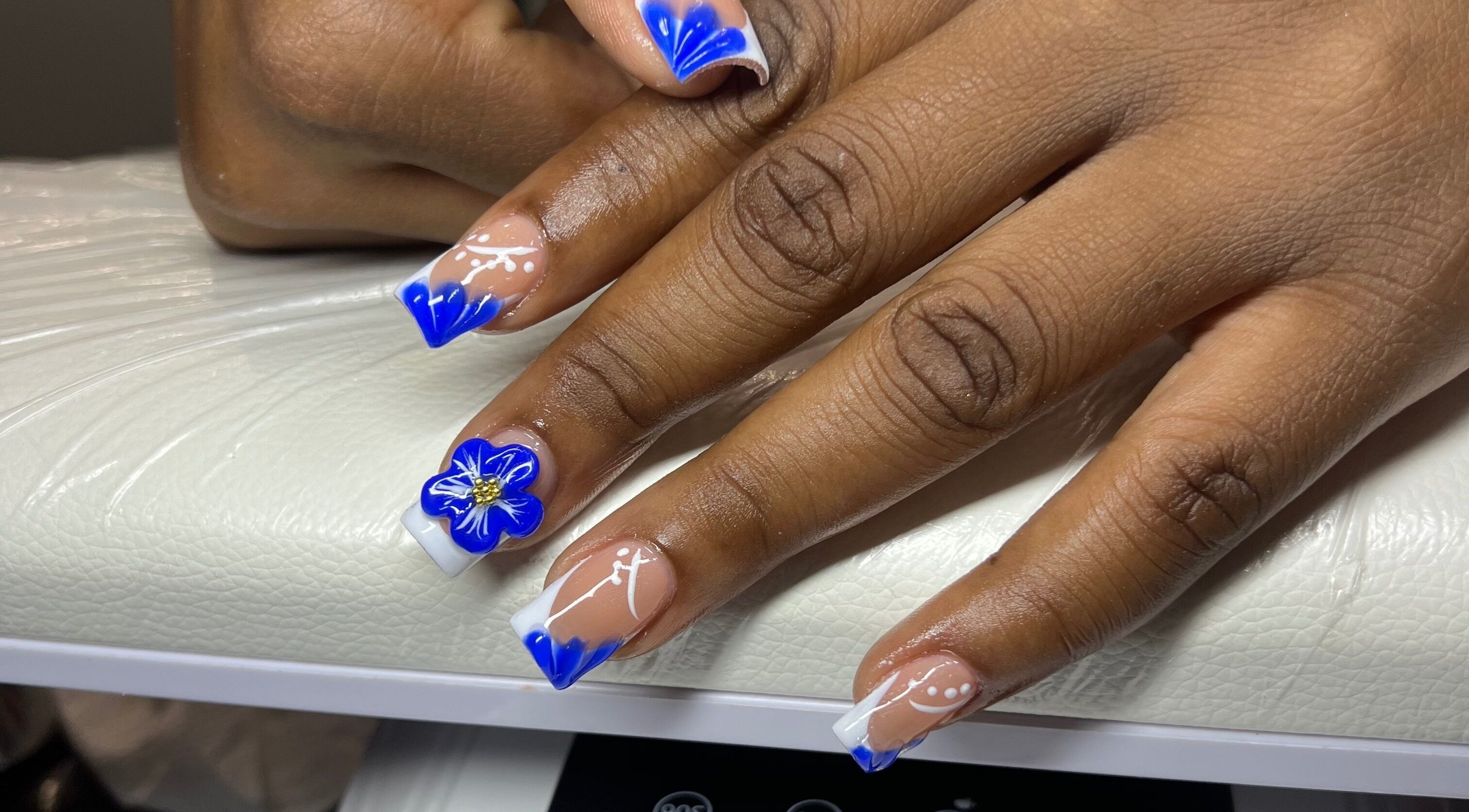 Elegant blue floral nail art at Luxe nails by Sher, Montego Bay, St. James Parish, JM.